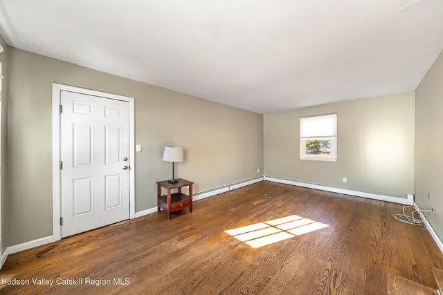a view of an empty room and window