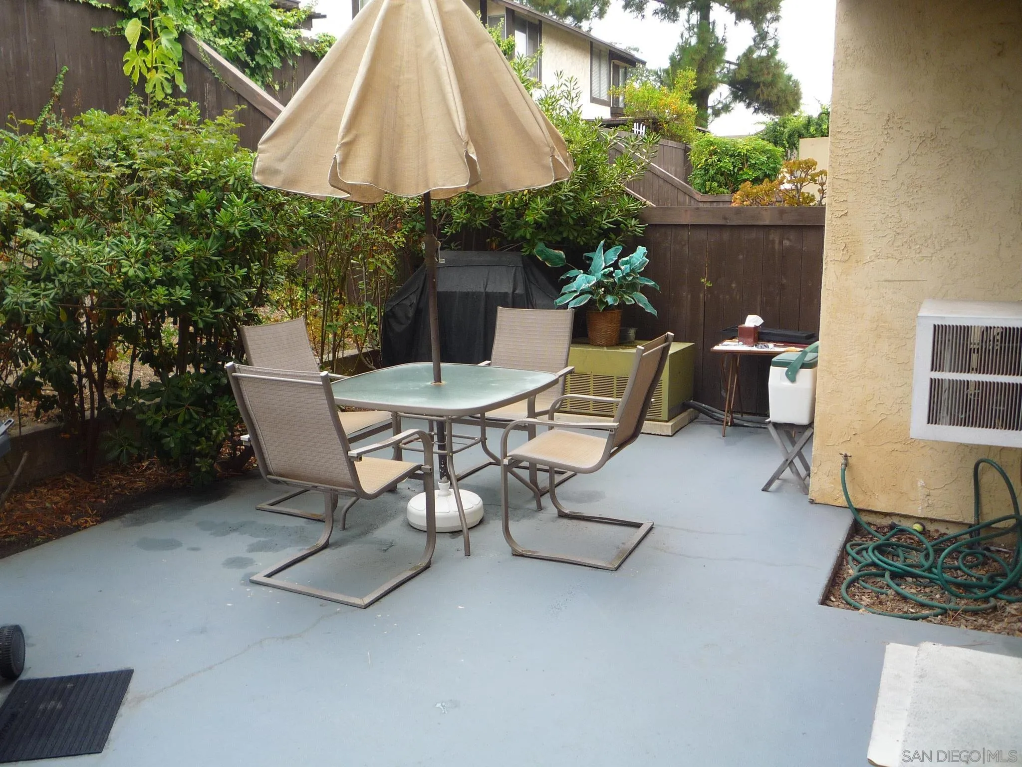 6876 Bear River Row, Unit 3 San Diego, CA 92139 - Photo 5 of 7 a view of a backyard with furniture and a potted plants