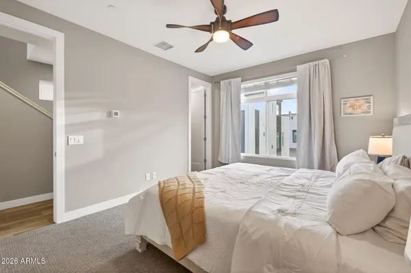 a bedroom with a bed and window