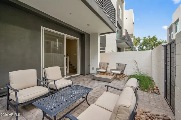a living room with furniture and a large window