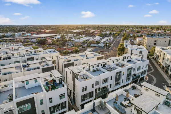 a balcony with table and chairs