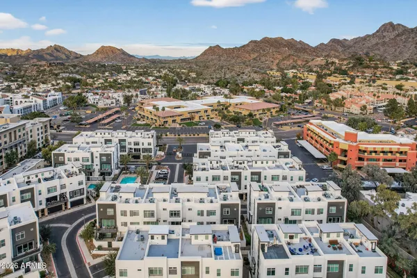an aerial view of residential houses with outdoor space