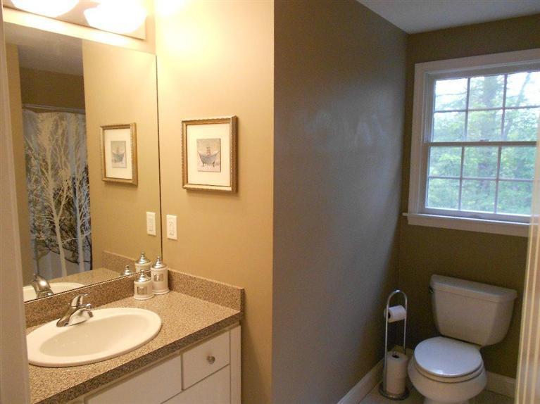 1171 Shootflying Hill Road Centerville, MA 02632 - Photo 11 of 16 a bathroom with a sink toilet and vanity