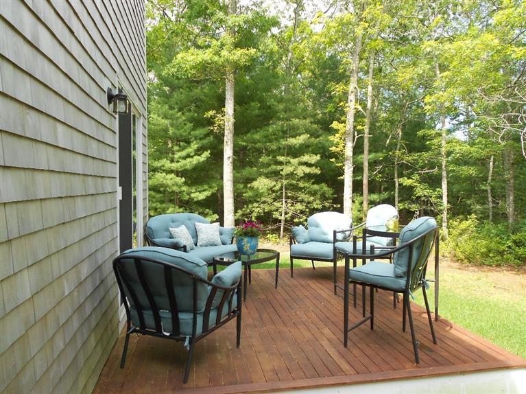 1171 Shootflying Hill Road Centerville, MA 02632 - Photo 16 of 16 a view of a chairs and table in the patio