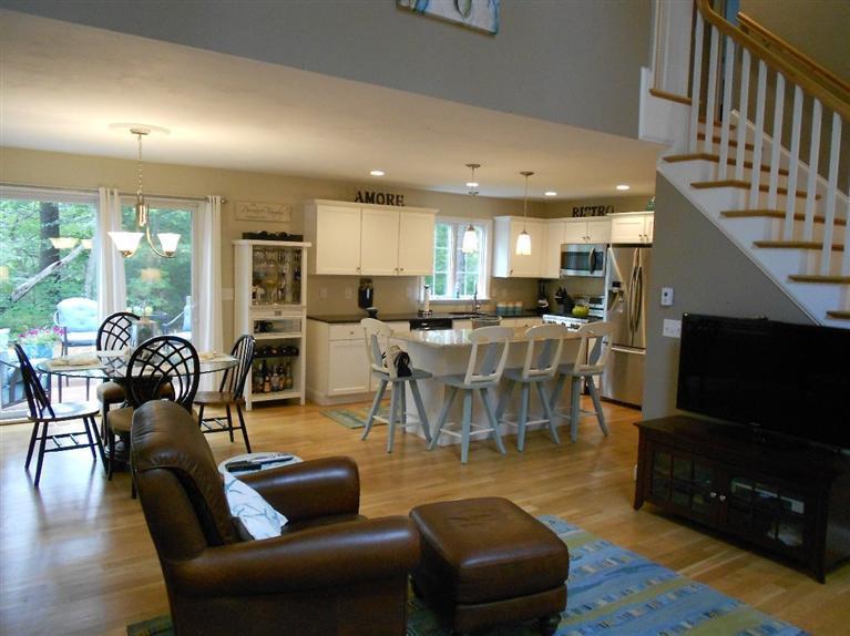 1171 Shootflying Hill Road Centerville, MA 02632 - Photo 3 of 16 a living room with fireplace furniture and a flat screen tv
