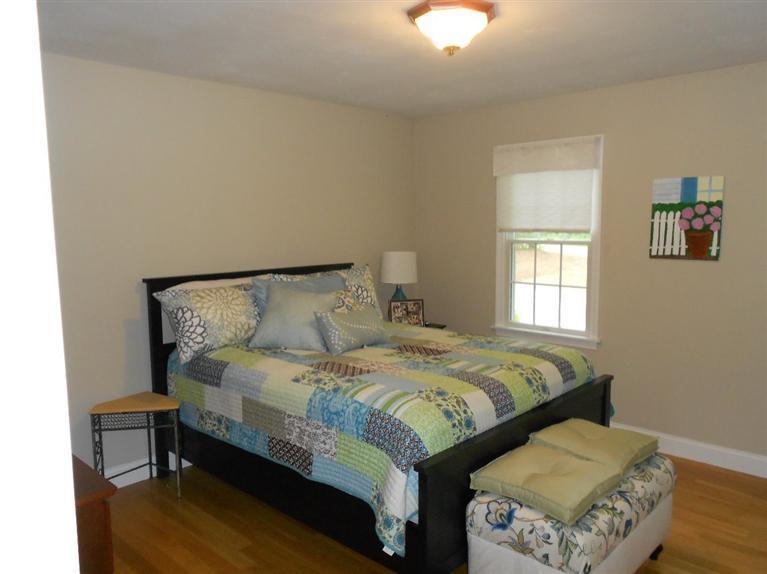 1171 Shootflying Hill Road Centerville, MA 02632 - Photo 7 of 16 a bedroom with a bed and window