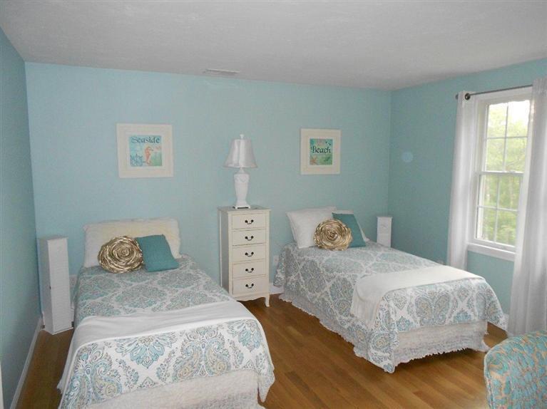 1171 Shootflying Hill Road Centerville, MA 02632 - Photo 8 of 16 a bedroom with a bed and wooden floor