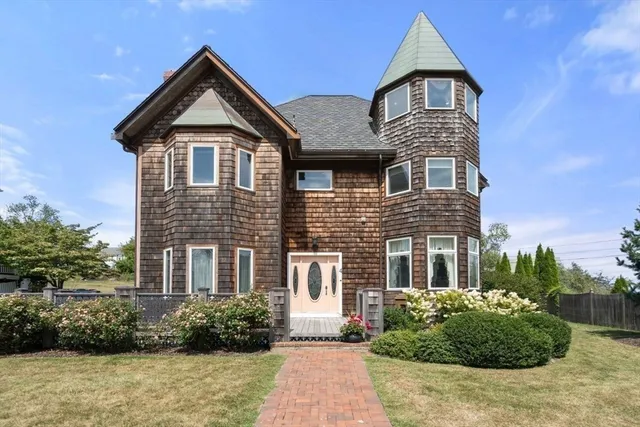 a front view of a house with a yard