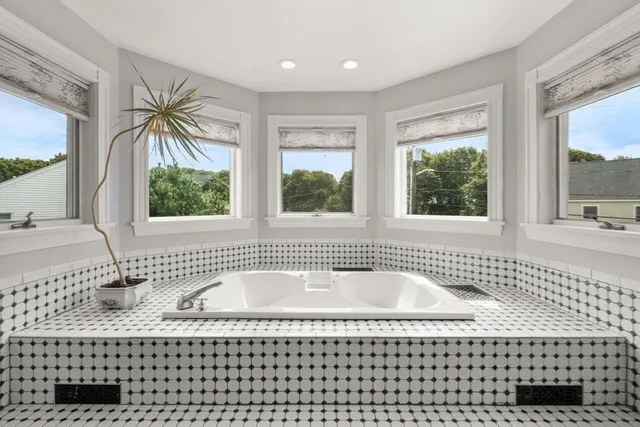 a bathroom with a bathtub and a shower