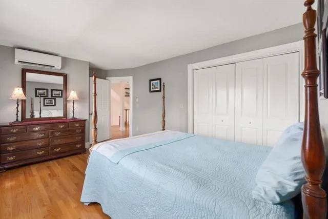 a bed room with a bed and a dresser