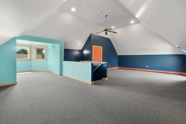 a living room with a chandelier furniture and a ceiling fan