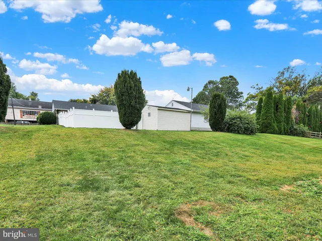 a view of a swimming pool with an outdoor space and seating area