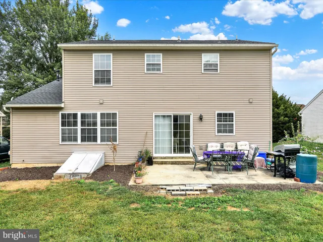 a backyard of a house with seating space