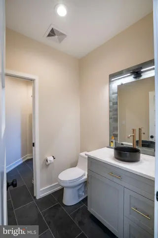 a bathroom with a double vanity sink and mirror