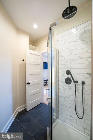 a bathroom with a shower and a bath tub