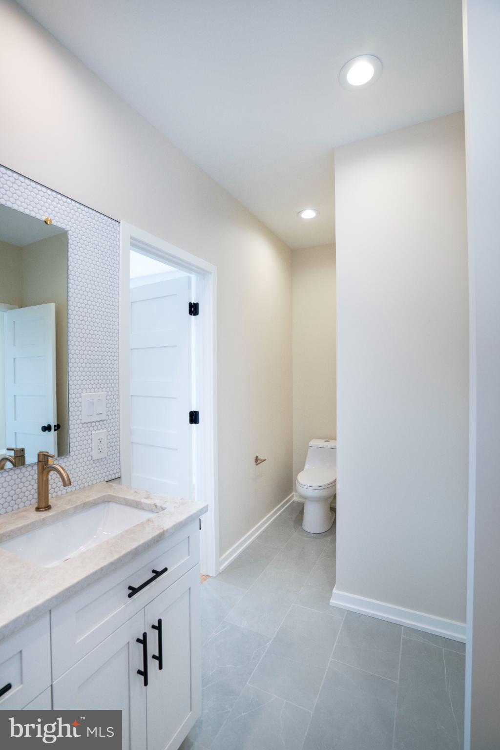 390 Trout Road State College, PA 16801 - Photo 53 of 93 Sleek modern bathroom with elegant finishes.