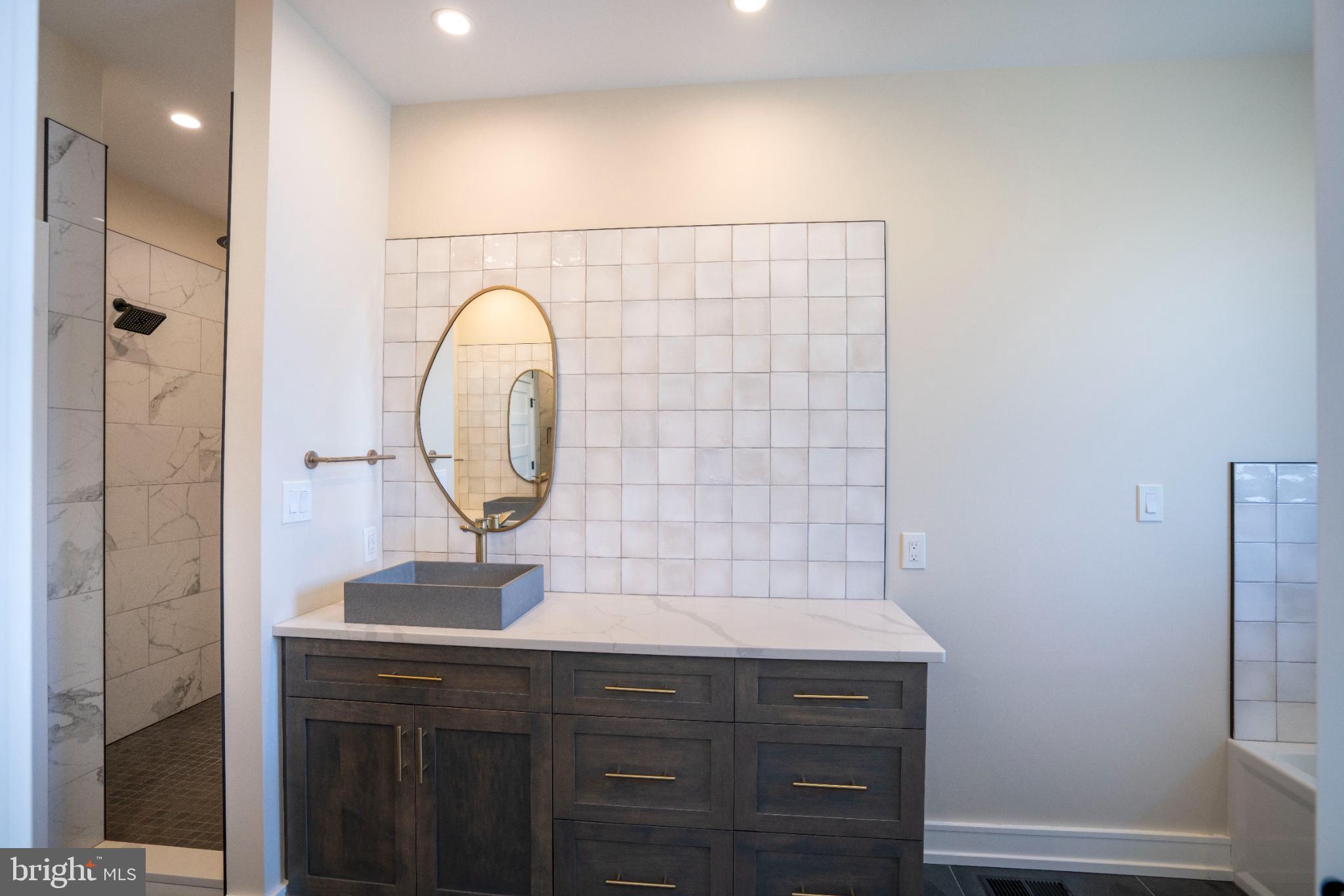 390 Trout Road State College, PA 16801 - Photo 64 of 93 Sleek modern bathroom with elegant finishes.