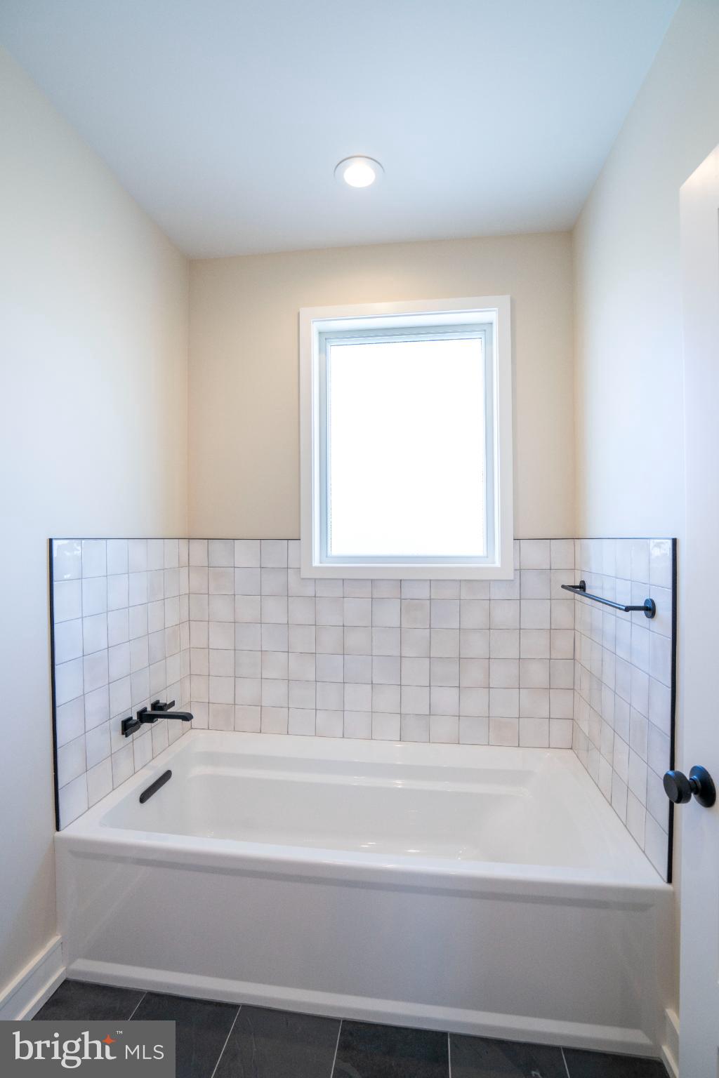 390 Trout Road State College, PA 16801 - Photo 65 of 93 Bright and airy bathroom with modern tiles.