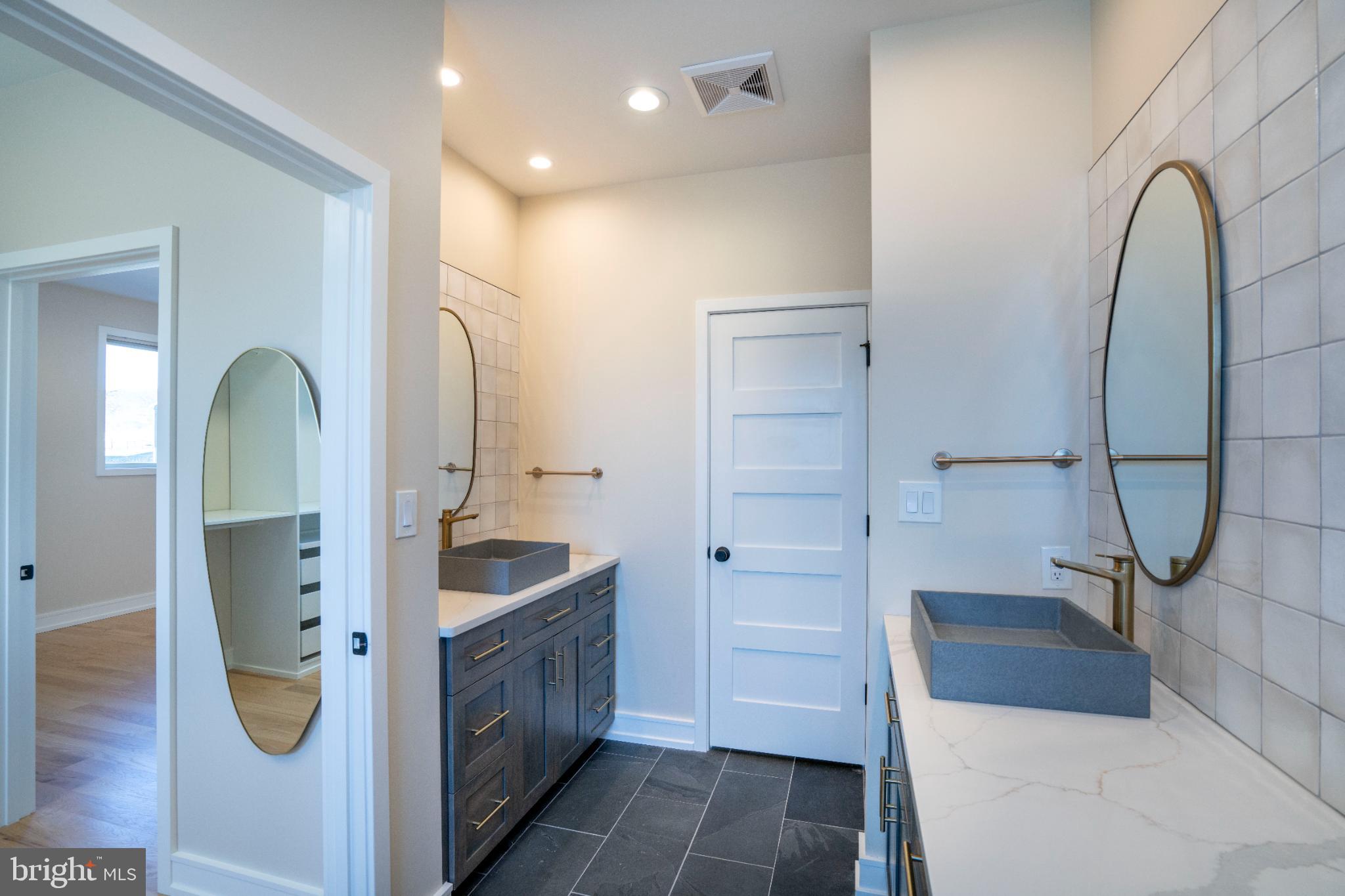 390 Trout Road State College, PA 16801 - Photo 66 of 93 Sleek modern bathroom with elegant finishes.