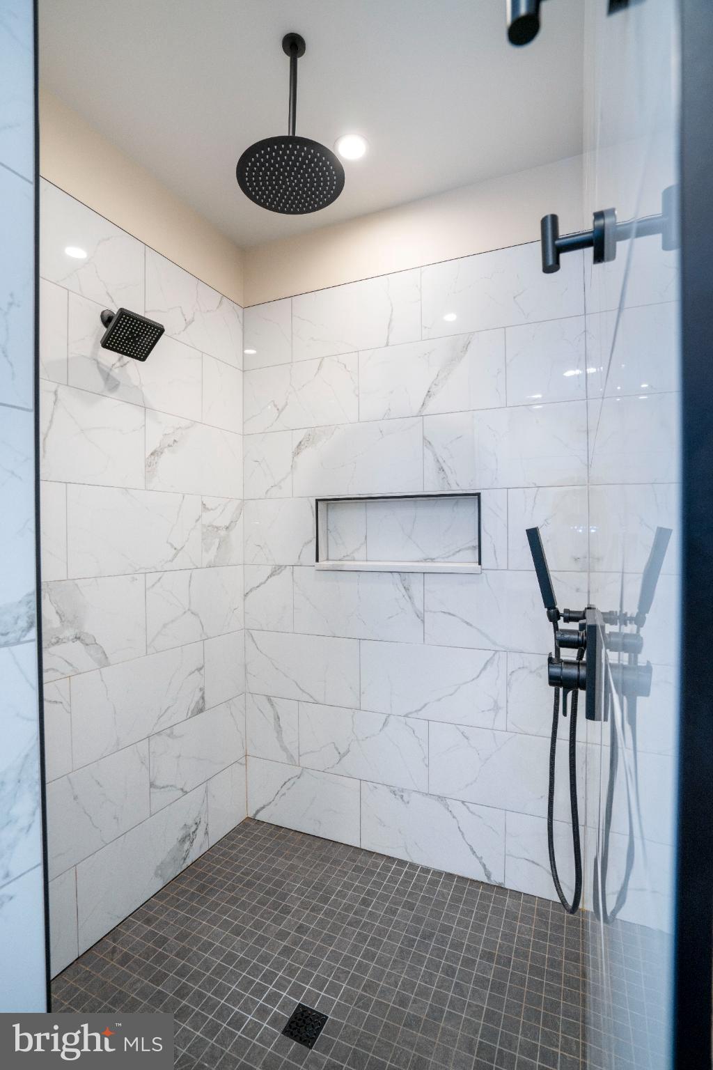 390 Trout Road State College, PA 16801 - Photo 68 of 93 Sleek marble shower with modern fixtures.