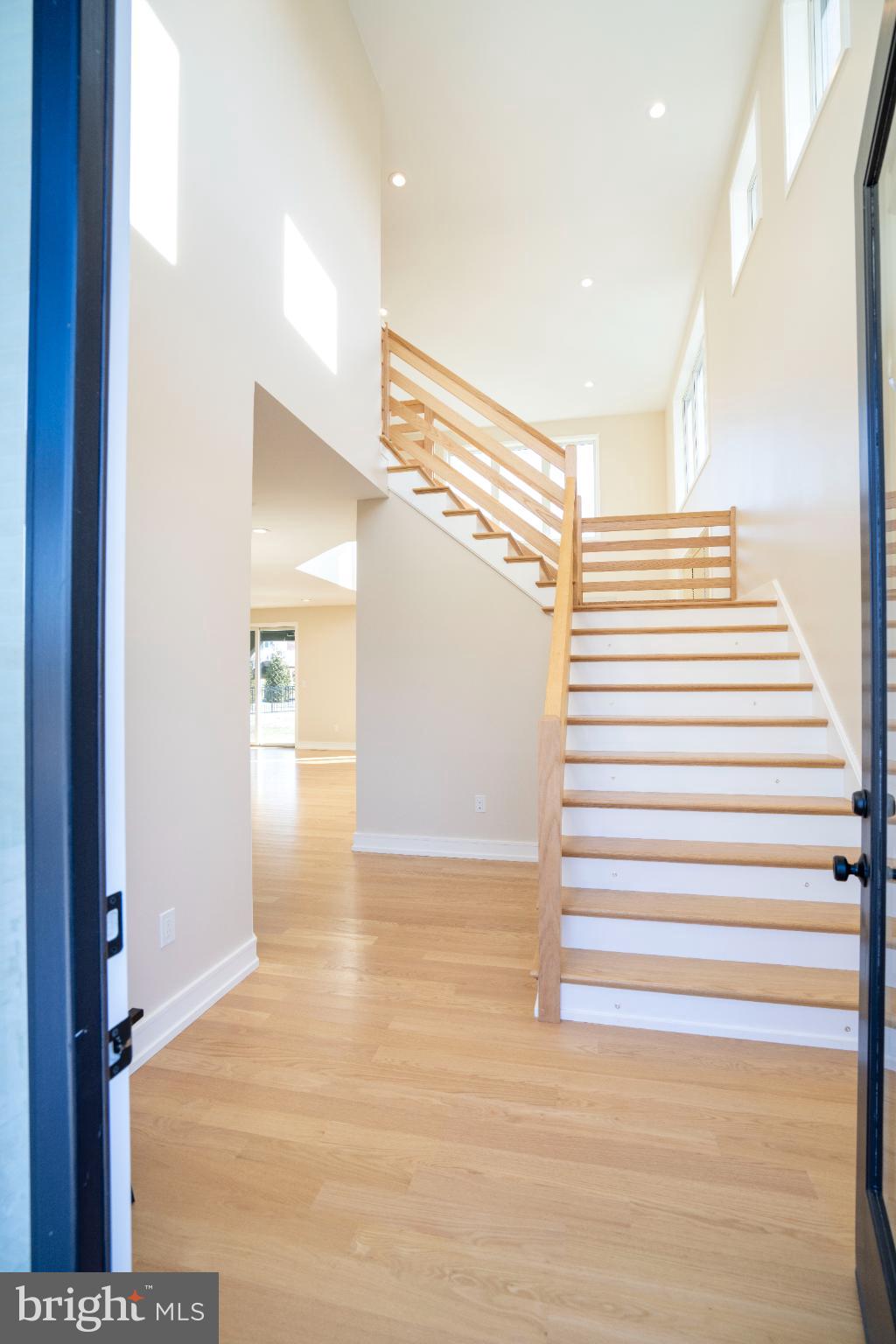 390 Trout Road State College, PA 16801 - Photo 7 of 93 Bright and airy entryway with modern staircase.