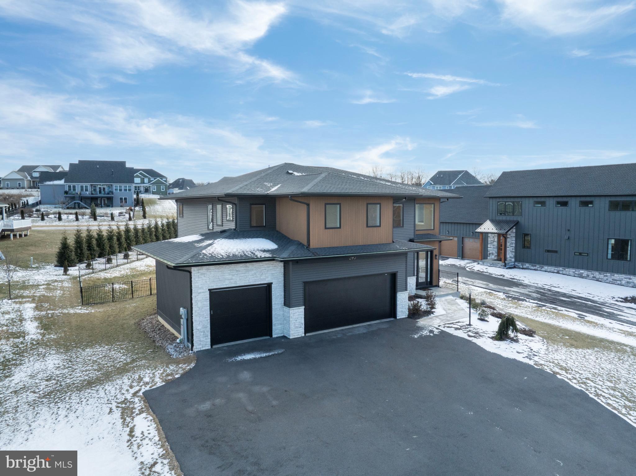 390 Trout Road State College, PA 16801 - Photo 77 of 93 Modern home with sleek design and snowy landscape.