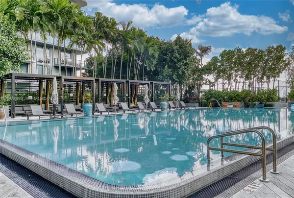 a view of swimming pool from a lake