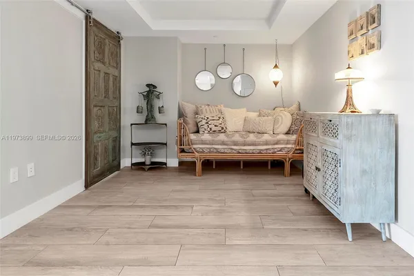 a view of a livingroom with furniture and window