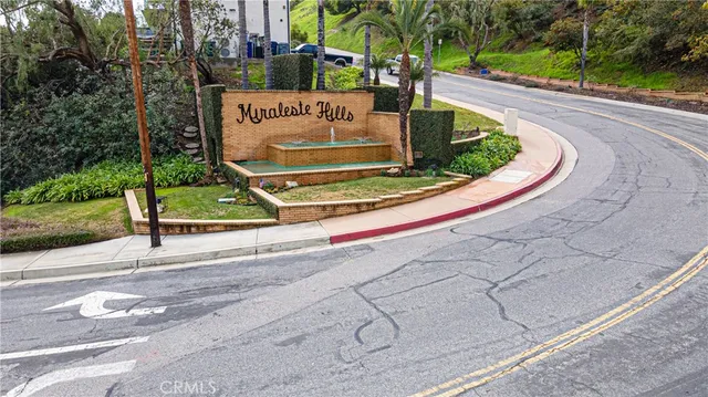 a view of a park with plants and trees