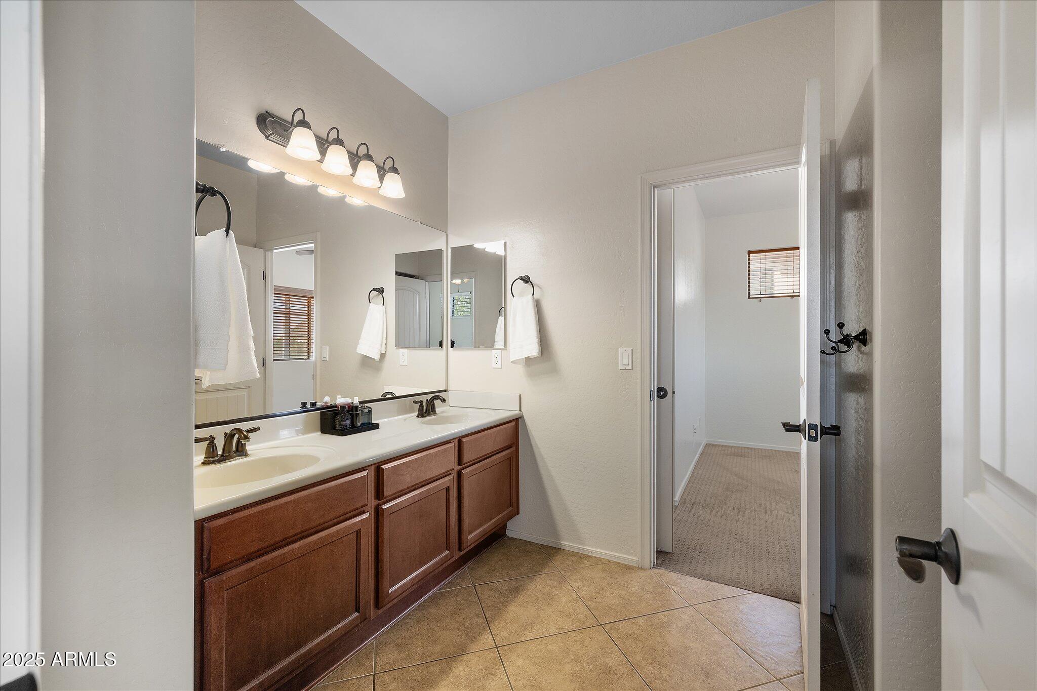 8536 East Inca Street Mesa, AZ 85207 - Photo 27 of 44 a bathroom with a sink vanity and shower