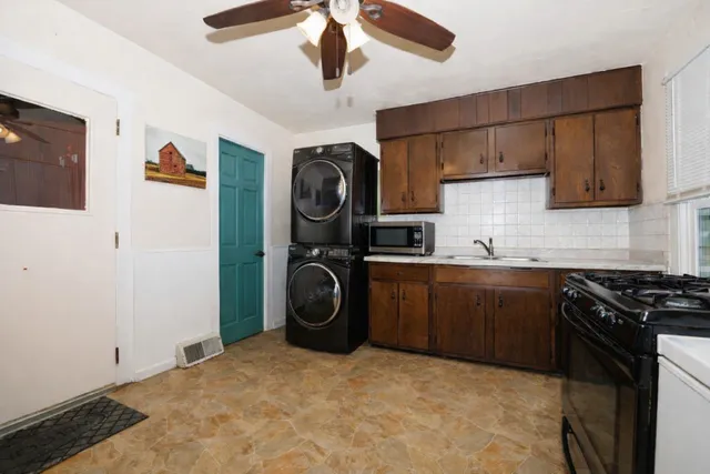 a bathroom with a sink a toilet and shower curtain