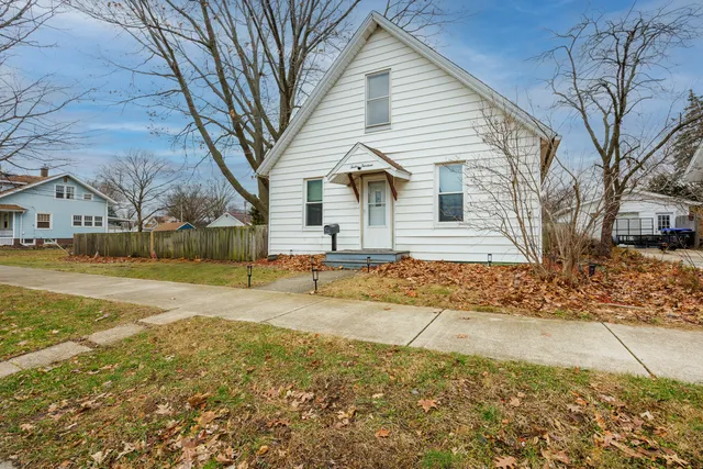 a view of a house with snow on the road