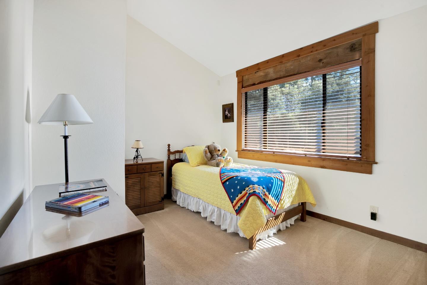 22682 Summit Road Los Gatos, CA 95033 - Photo 11 of 32 a bed sitting in a bedroom next to a window