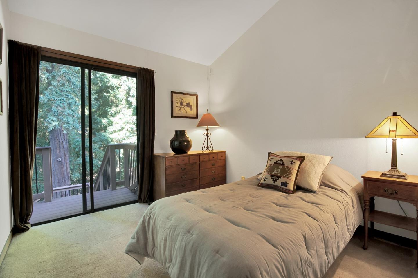 22682 Summit Road Los Gatos, CA 95033 - Photo 12 of 32 a bedroom with a bed and a lamp next to a window
