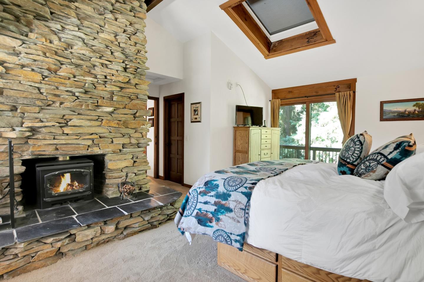 22682 Summit Road Los Gatos, CA 95033 - Photo 14 of 32 a bedroom with a bed a fireplace and window