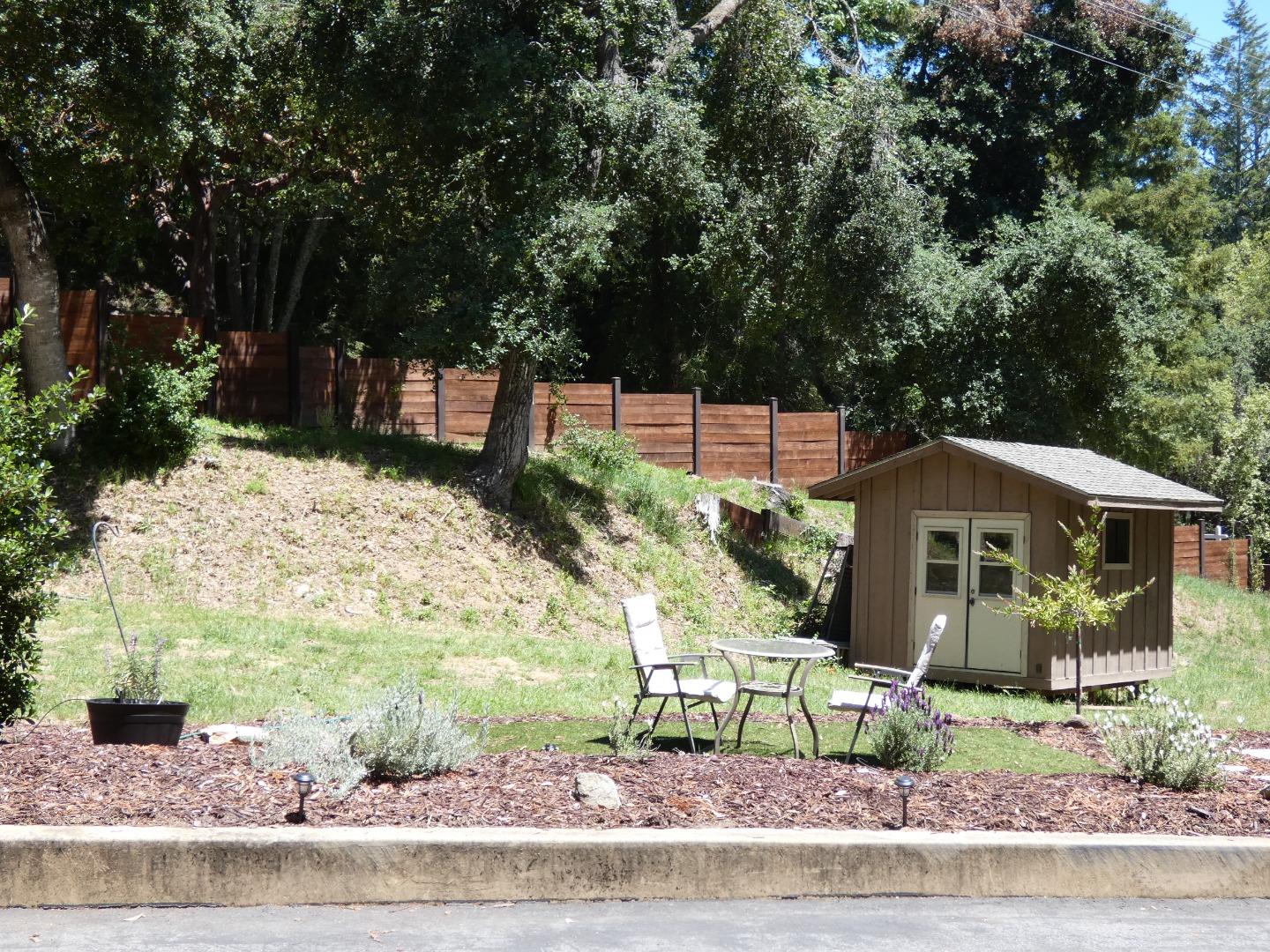 22682 Summit Road Los Gatos, CA 95033 - Photo 24 of 32 a front view of a house with a yard and potted plants