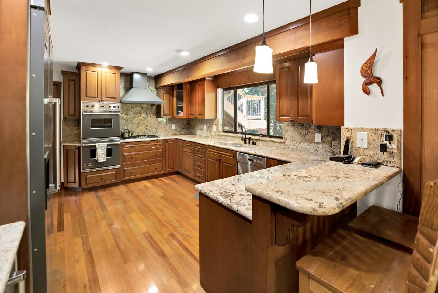 22682 Summit Road Los Gatos, CA 95033 - Photo 6 of 32 a kitchen with stainless steel appliances granite countertop a sink counter space and refrigerator