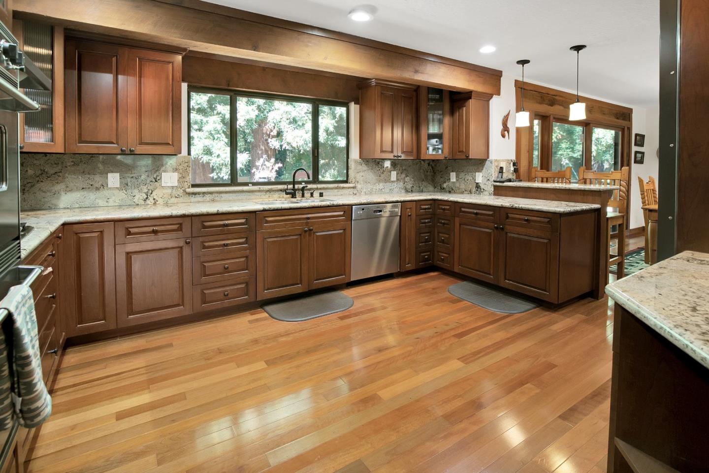 22682 Summit Road Los Gatos, CA 95033 - Photo 7 of 32 a kitchen with stainless steel appliances granite countertop a stove a sink and a microwave