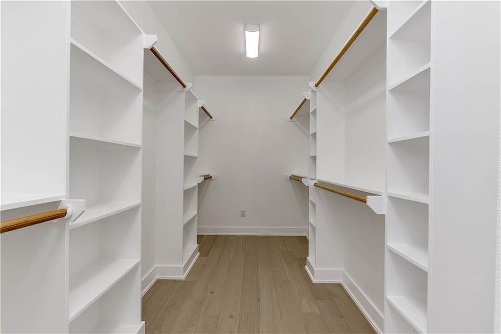 5002 Pecan Springs Road, Unit 10 Austin, TX 78723 - Photo 15 of 29 Walk in closet with wood finished floors