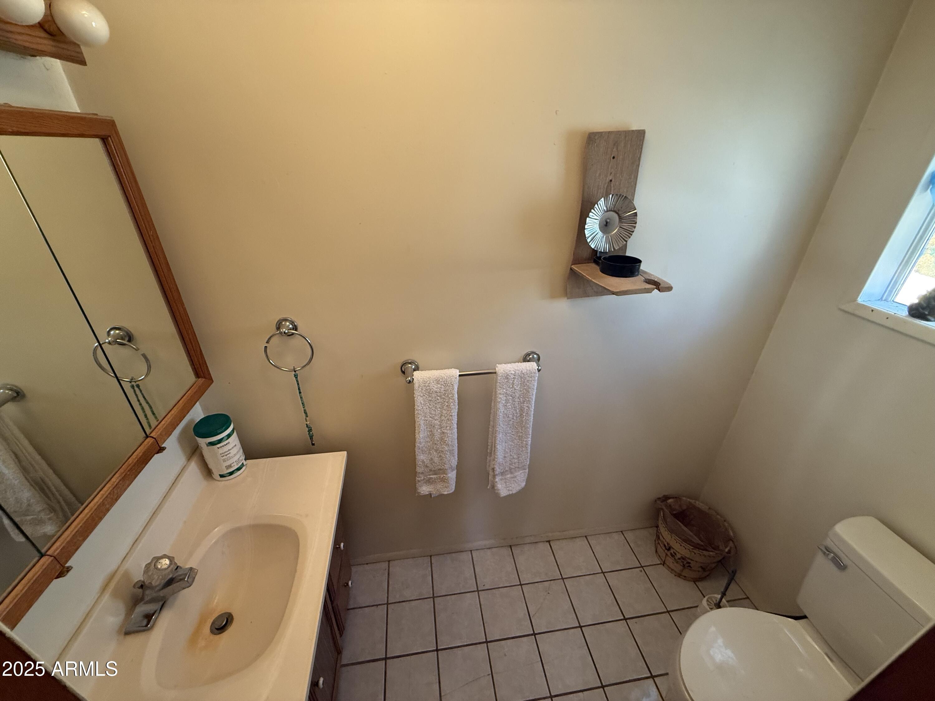 23576 Sunny South Road Crown King, AZ 86343 - Photo 15 of 29 a bathroom with a toilet and a mirror