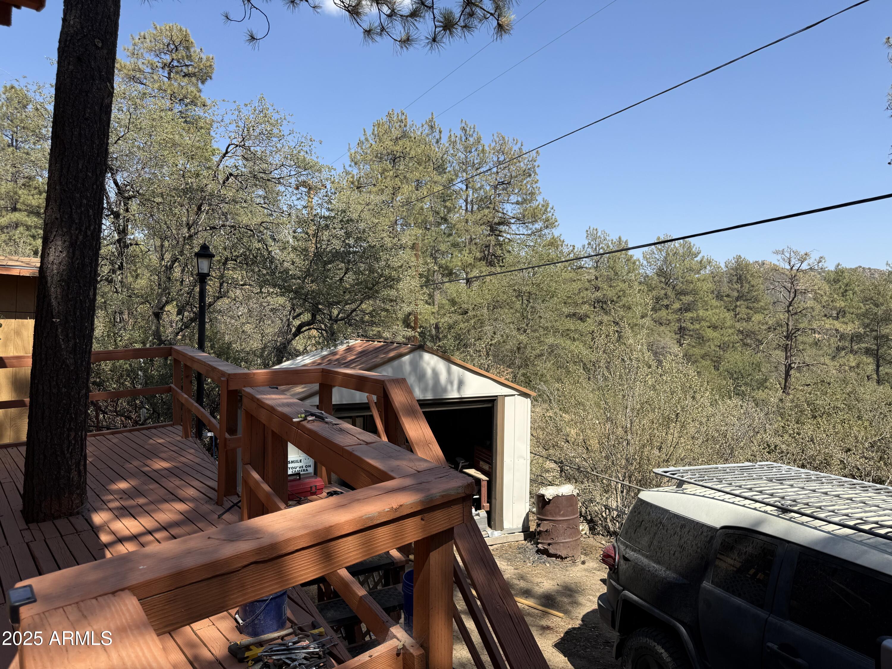 23576 Sunny South Road Crown King, AZ 86343 - Photo 17 of 29 a view of a balcony with chairs