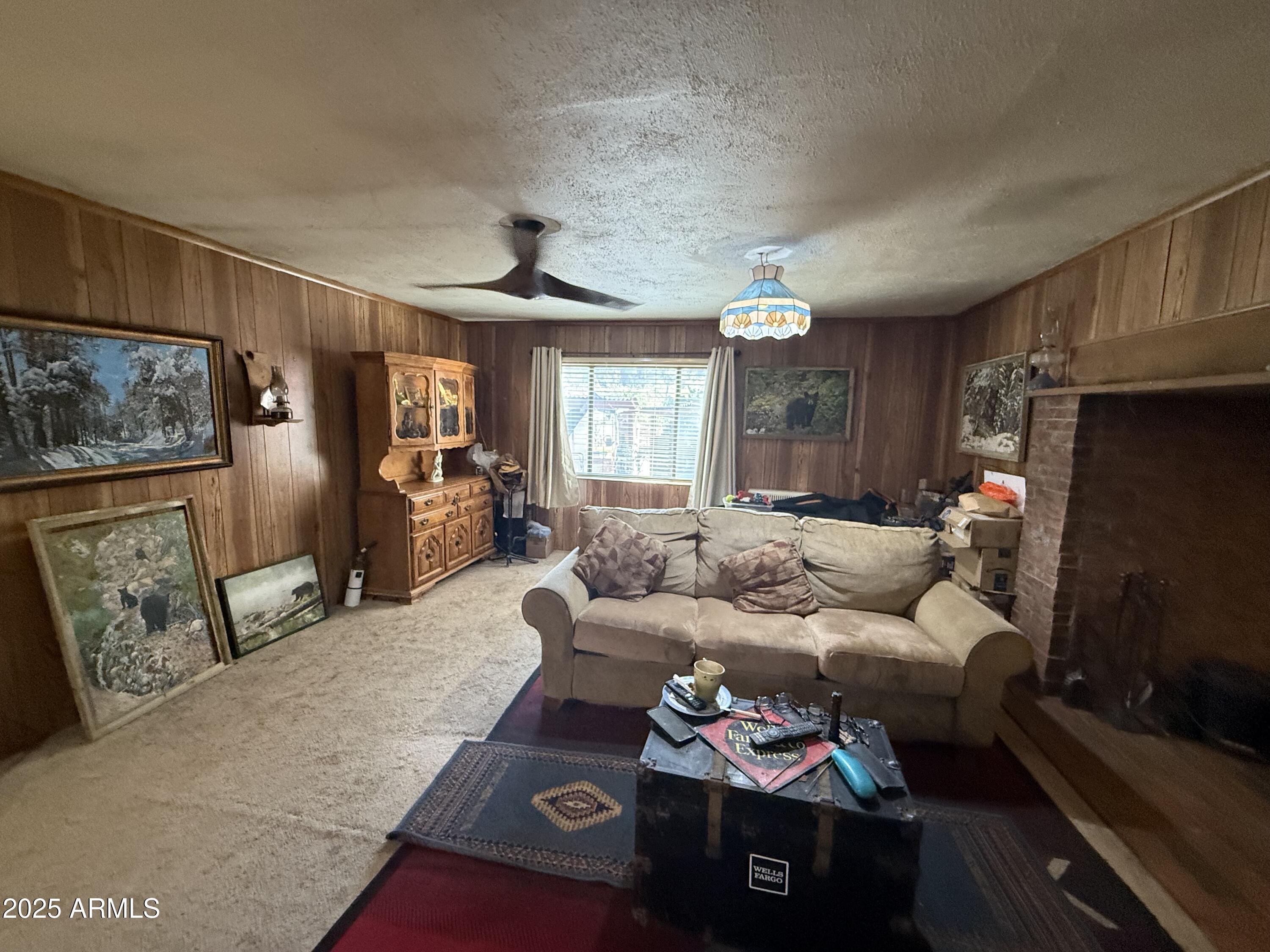 23576 Sunny South Road Crown King, AZ 86343 - Photo 25 of 29 a living room with furniture and a flat screen tv