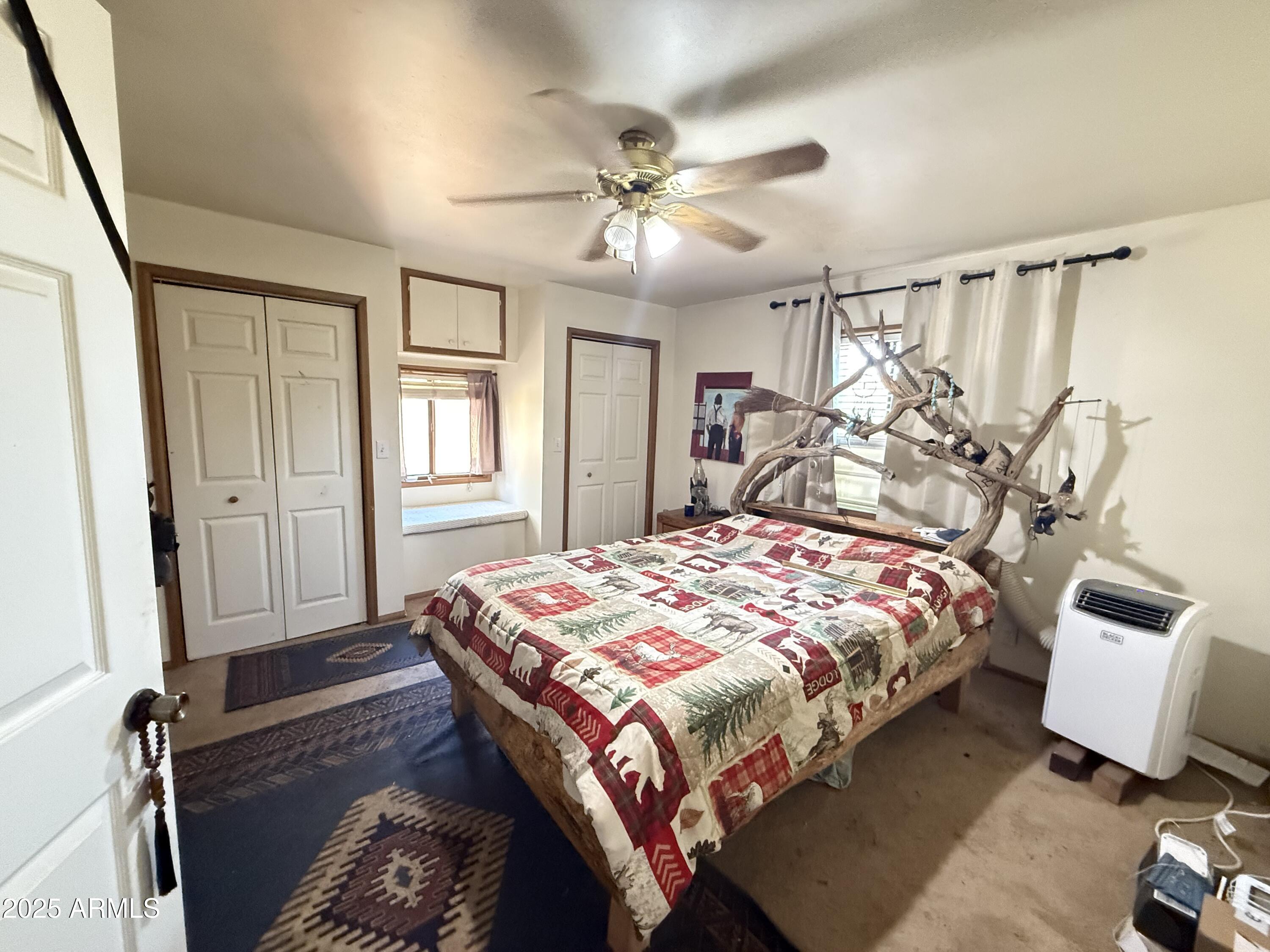 23576 Sunny South Road Crown King, AZ 86343 - Photo 4 of 29 a bedroom with a bed and window