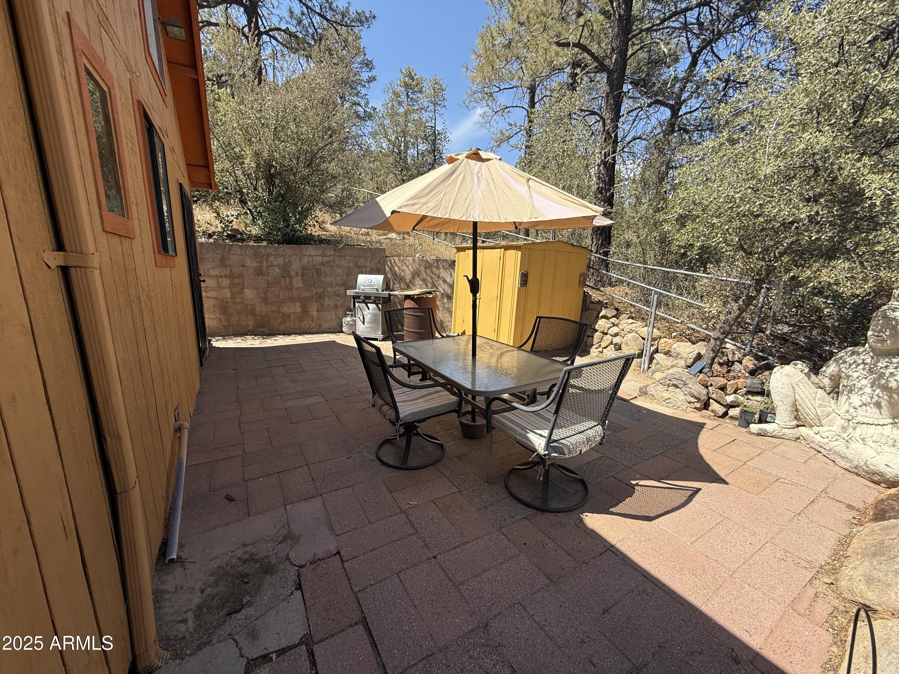 23576 Sunny South Road Crown King, AZ 86343 - Photo 7 of 29 a view of backyard with a patio and outdoor seating