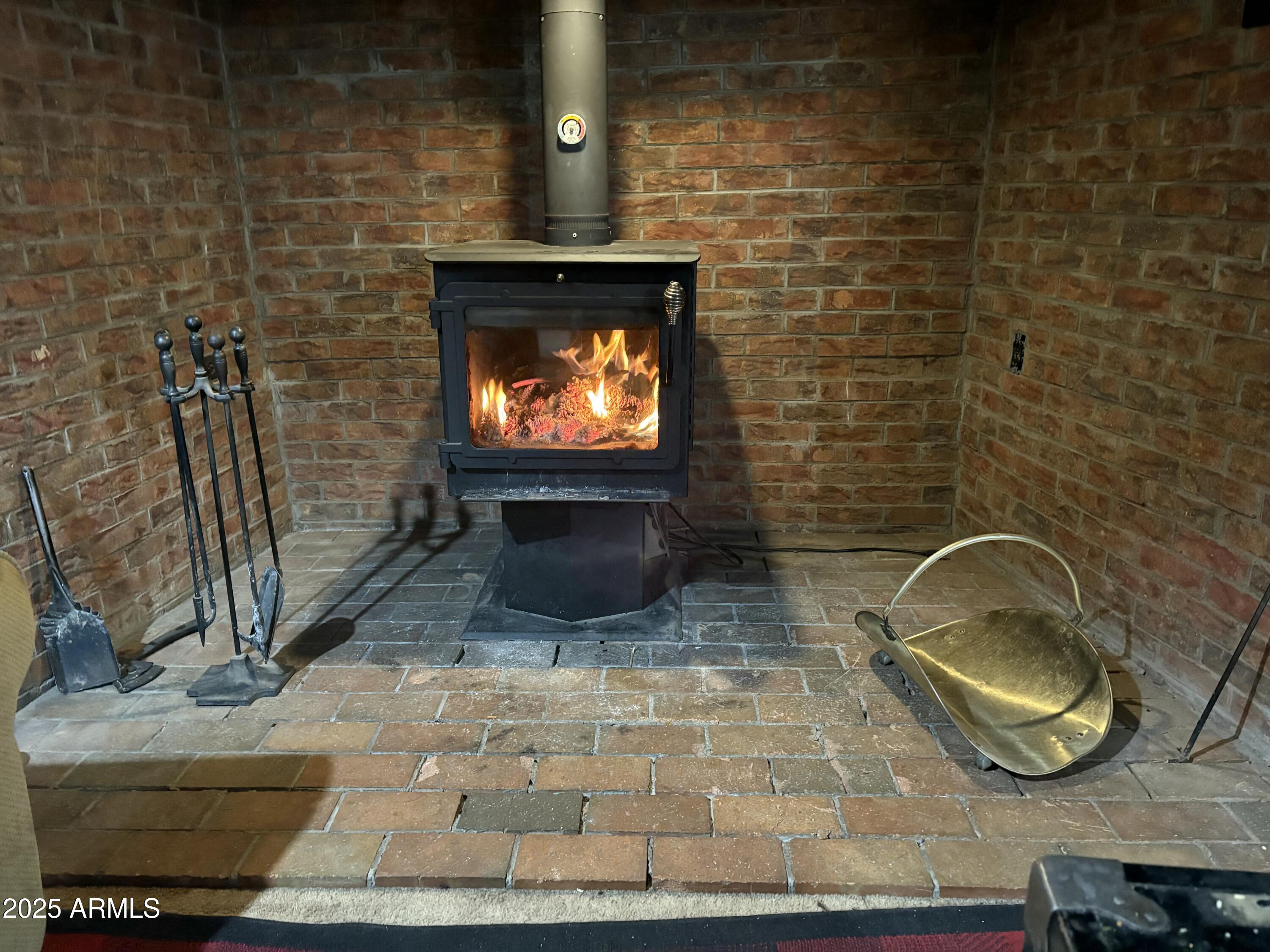 23576 Sunny South Road Crown King, AZ 86343 - Photo 10 of 29 a living room with a fireplace