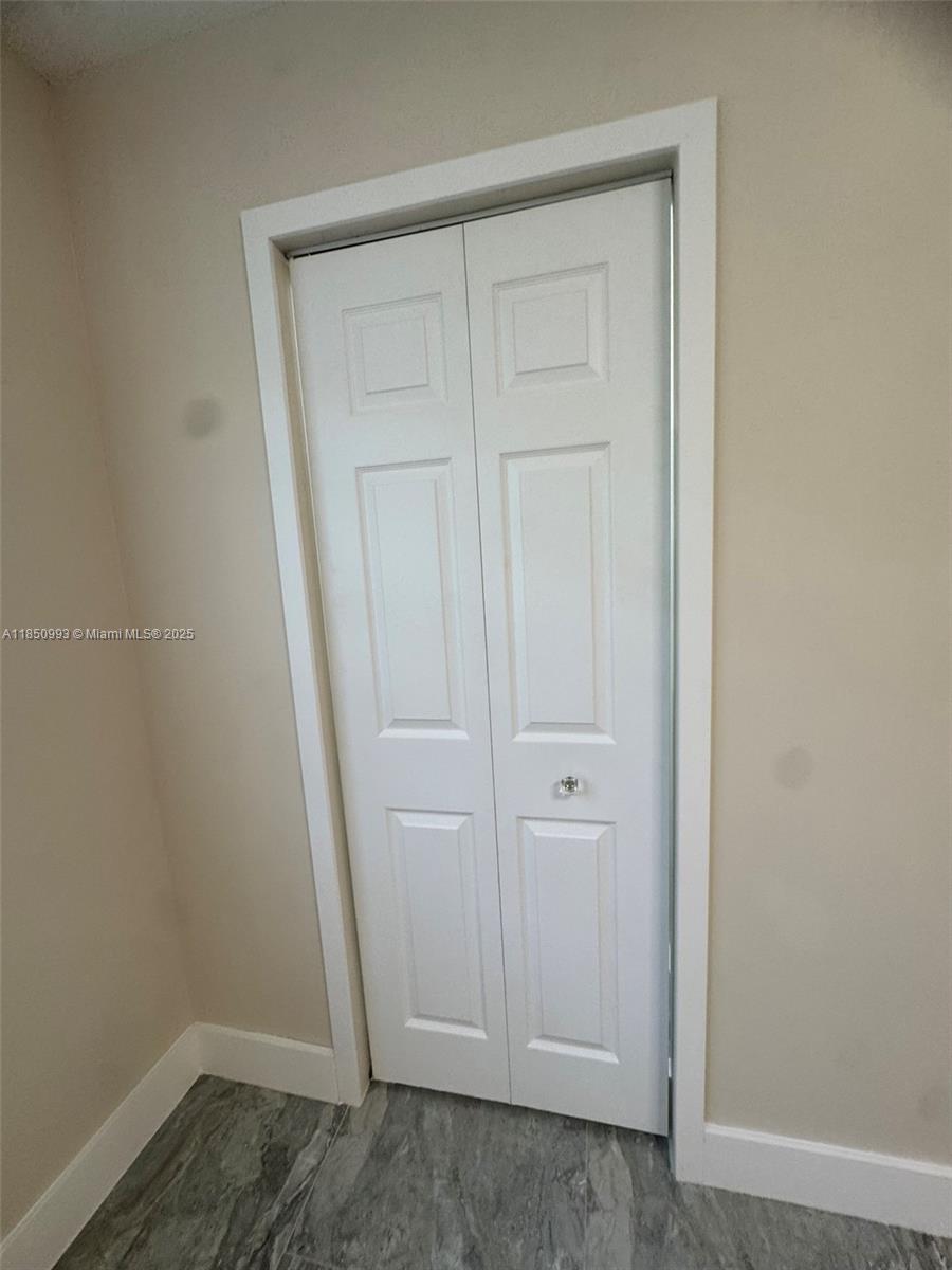 4520 Southwest 68th Ct Circle, Unit 305 Miami, FL 33155 - Photo 32 of 46 an empty room with wooden floor