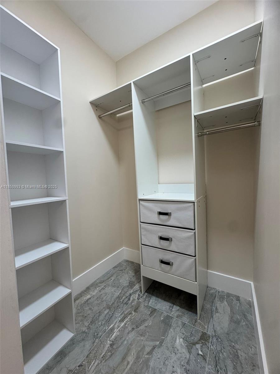 4520 Southwest 68th Ct Circle, Unit 305 Miami, FL 33155 - Photo 33 of 46 a view of an empty walk in closet