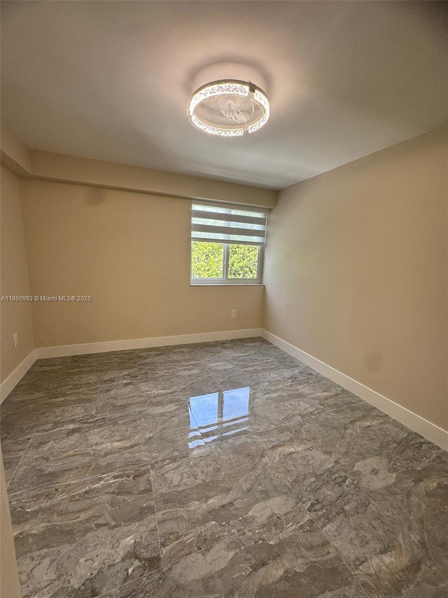 4520 Southwest 68th Ct Circle, Unit 305 Miami, FL 33155 - Photo 35 of 46 an empty room with windows