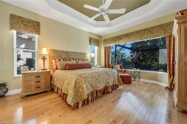 a bed room with a bed and a large window