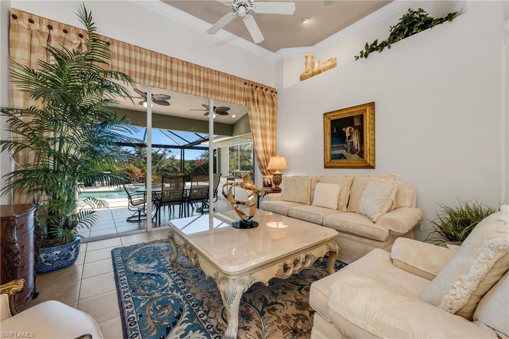 20001 Chapel Trace Estero, FL 33928 - Photo 19 of 32 a living room with patio furniture and a potted plant